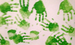 Jared, age 2, chose to make green handprints.